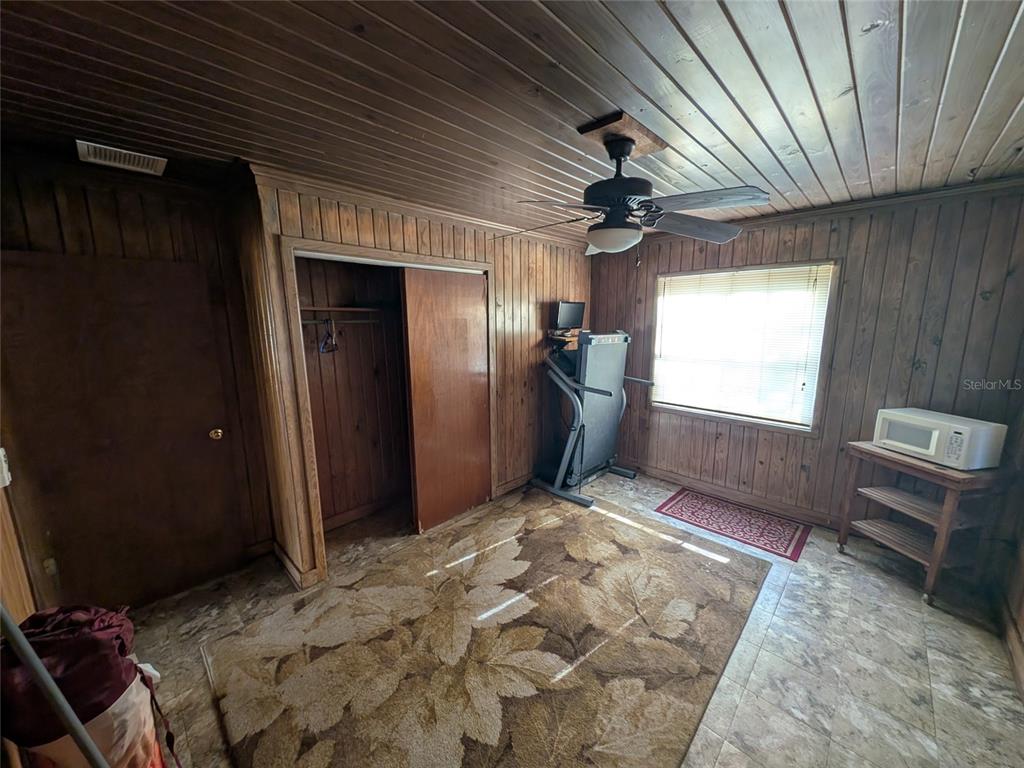13668 Northeast 226th Avenue Road Salt Springs, FL 32134 - Photo 26 of 30 a view of a livingroom with a chandelier
