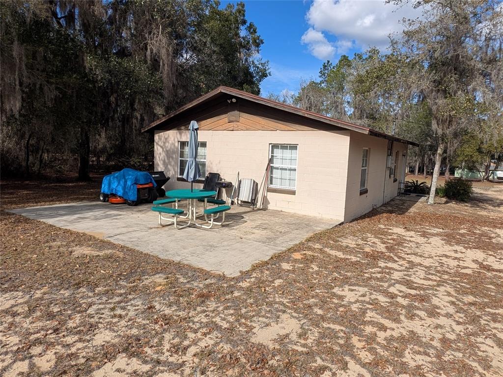 13668 Northeast 226th Avenue Road Salt Springs, FL 32134 - Photo 6 of 30 a view of a house with a snow in the yard