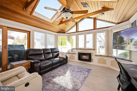 a large kitchen with stainless steel appliances granite countertop a stove sink and cabinets