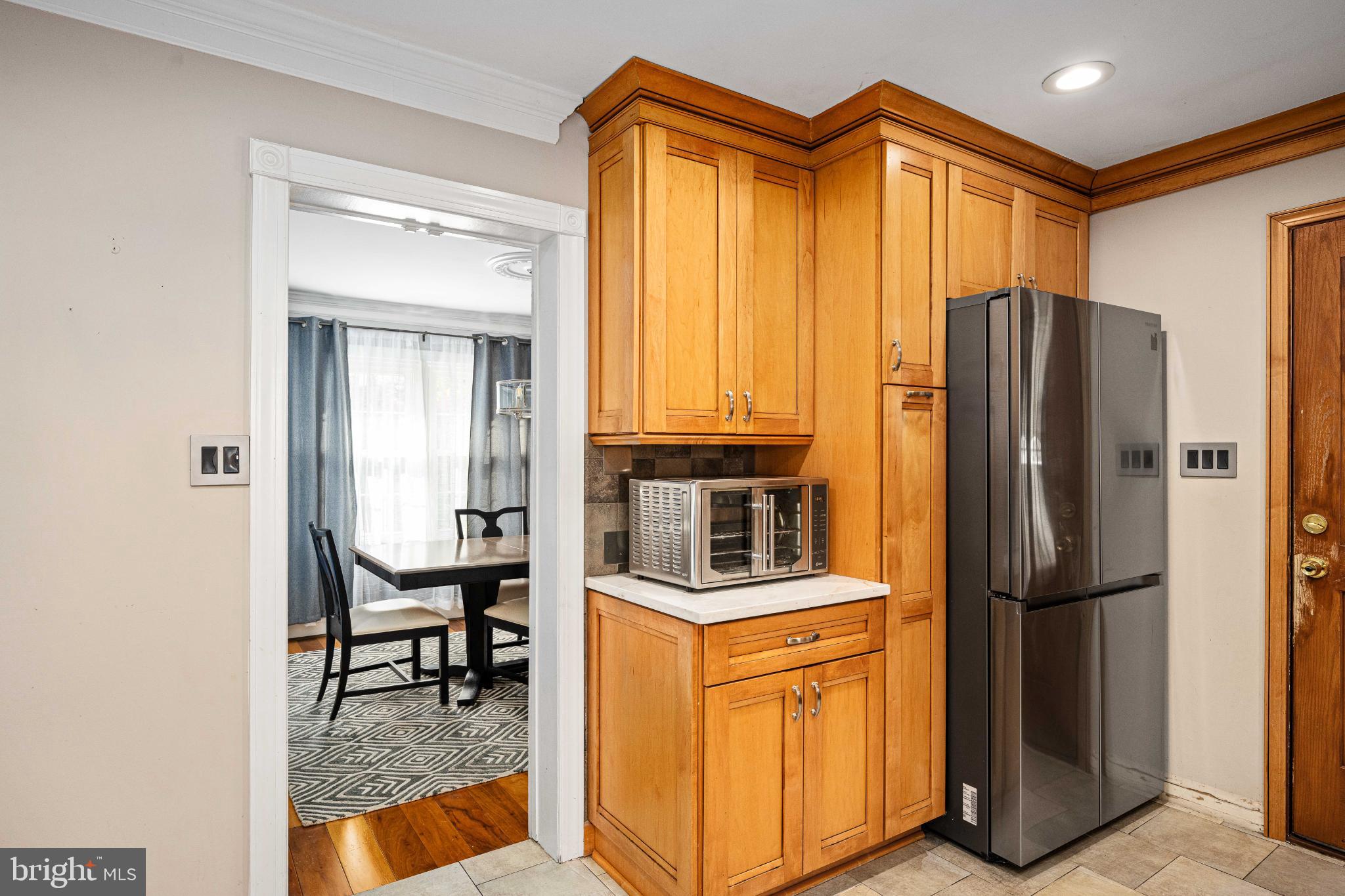 224 Prince Street Northeast Leesburg, VA 20176 - Photo 23 of 79 Modern kitchen with warm wood accents.