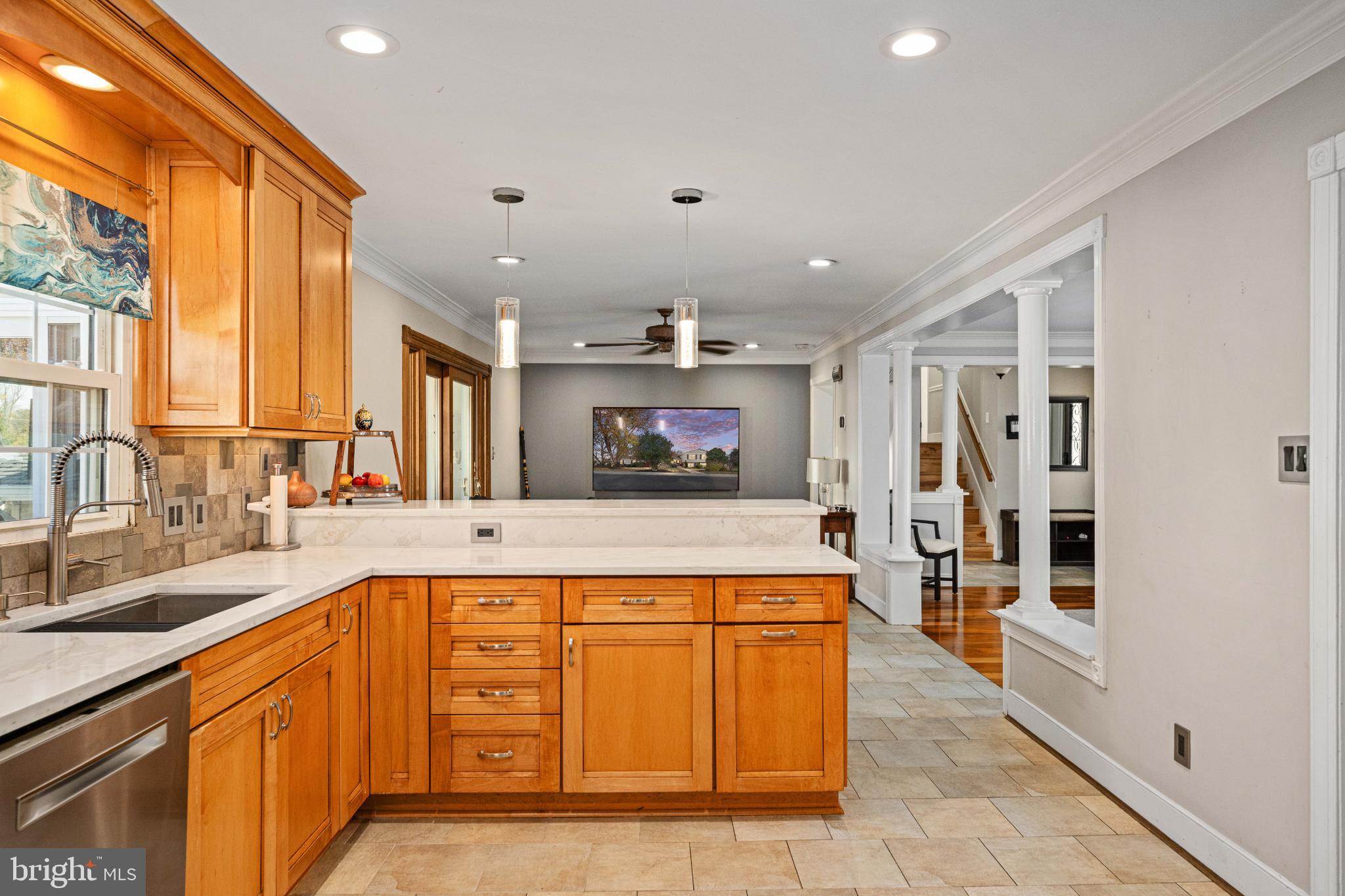 224 Prince Street Northeast Leesburg, VA 20176 - Photo 23 of 84 a large kitchen with stainless steel appliances a large counter top a stove a sink and a refrigerator