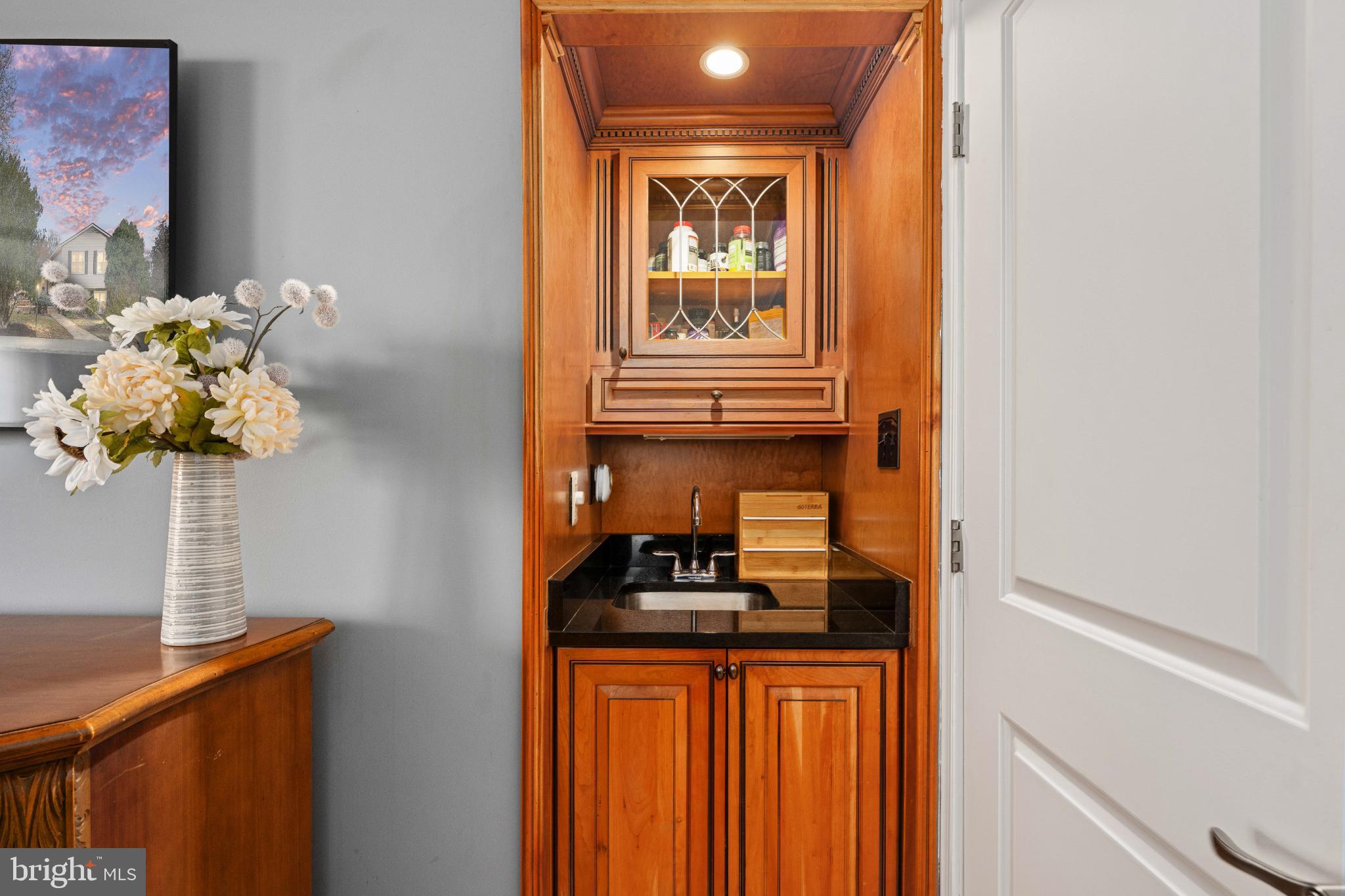 224 Prince Street Northeast Leesburg, VA 20176 - Photo 41 of 79 Elegant wet bar with rich wood accents.