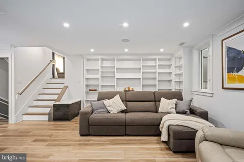 a view of a livingroom with furniture and a flat screen tv