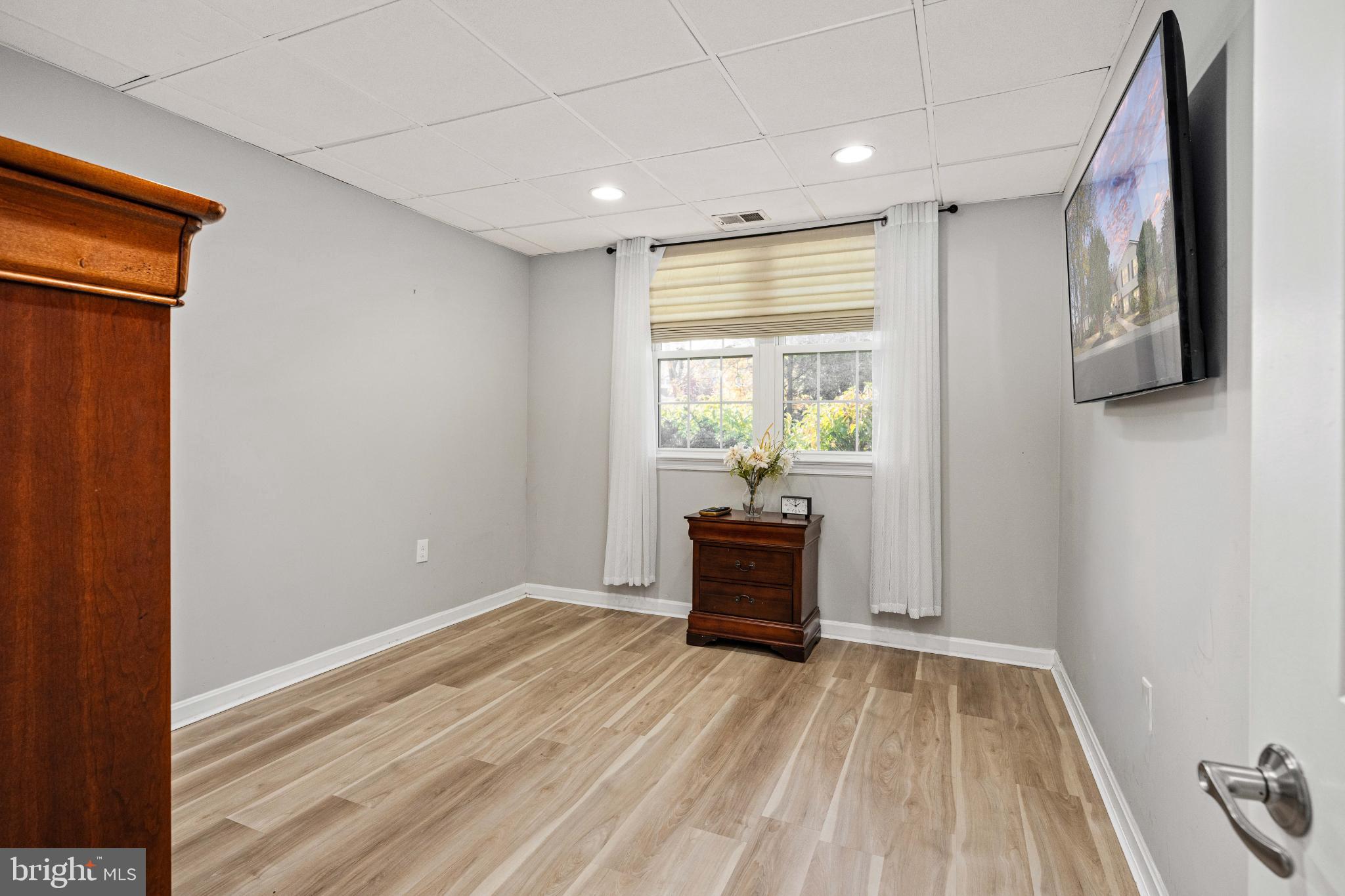 224 Prince Street Northeast Leesburg, VA 20176 - Photo 47 of 84 a view of room with window and wooden floor