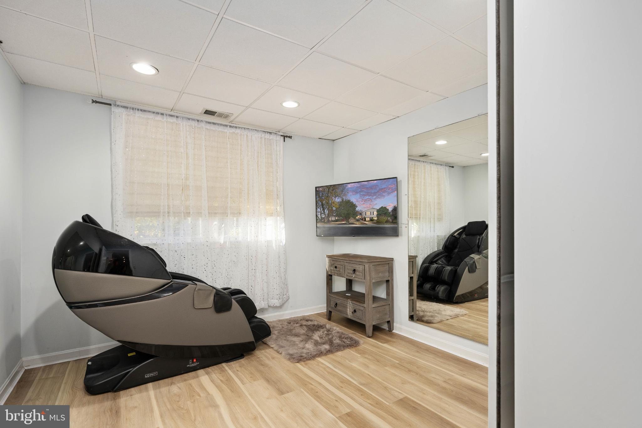 224 Prince Street Northeast Leesburg, VA 20176 - Photo 50 of 84 a room with furniture and a flat screen tv