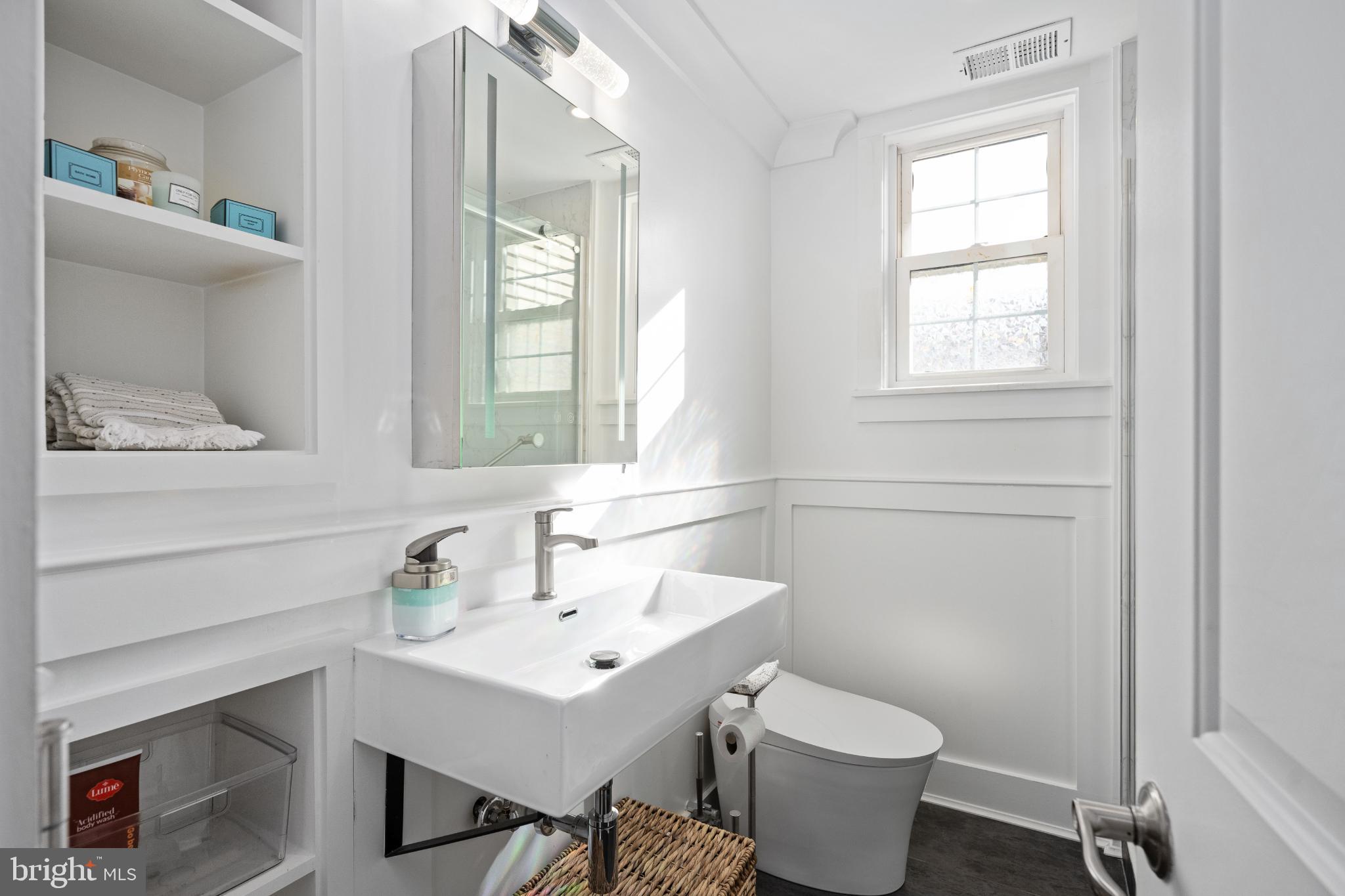 224 Prince Street Northeast Leesburg, VA 20176 - Photo 52 of 84 a bathroom with a toilet sink and mirror