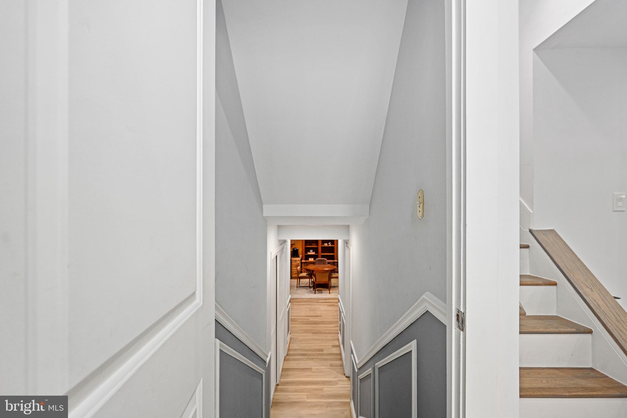 224 Prince Street Northeast Leesburg, VA 20176 - Photo 59 of 84 a view of a hallway with wooden floor and staircase