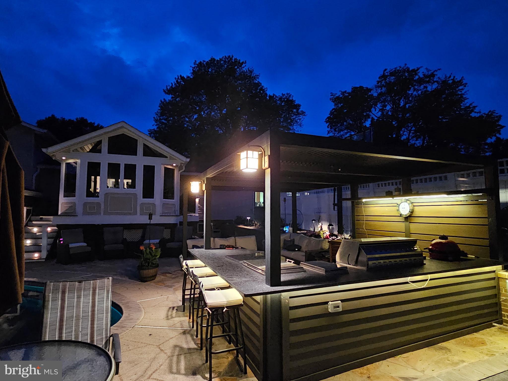 224 Prince Street Northeast Leesburg, VA 20176 - Photo 83 of 84 Charming outdoor oasis under twilight skies.