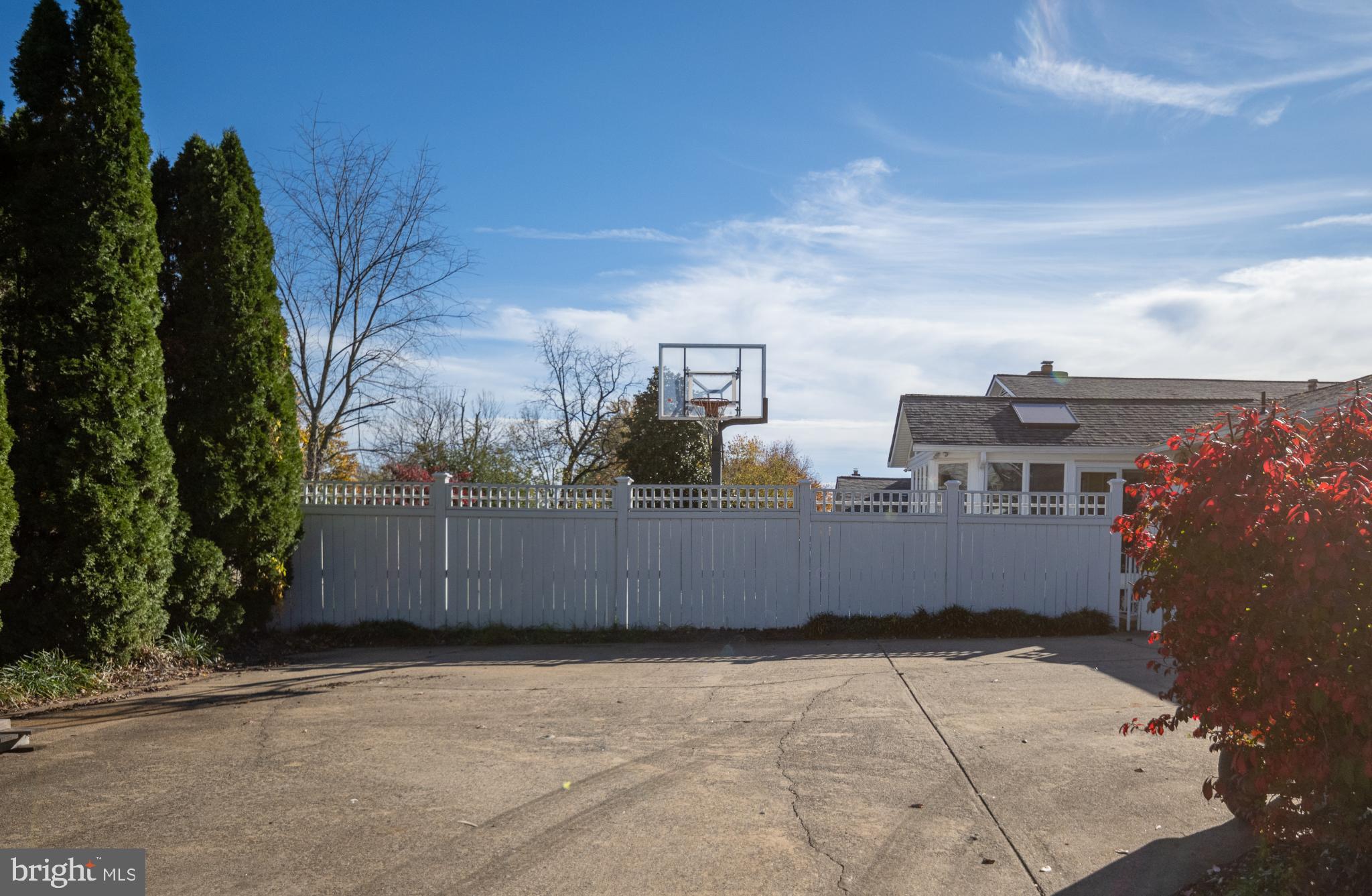 224 Prince Street Northeast Leesburg, VA 20176 - Photo 84 of 84 Sunny driveway with a basketball hoop.