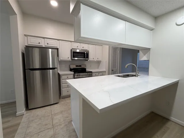 a view of a kitchen with a sink and dishwasher kitchen view