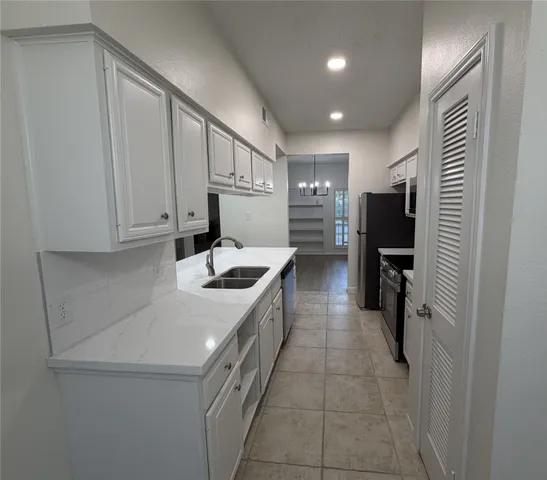 a bathroom with a sink a mirror and toilet