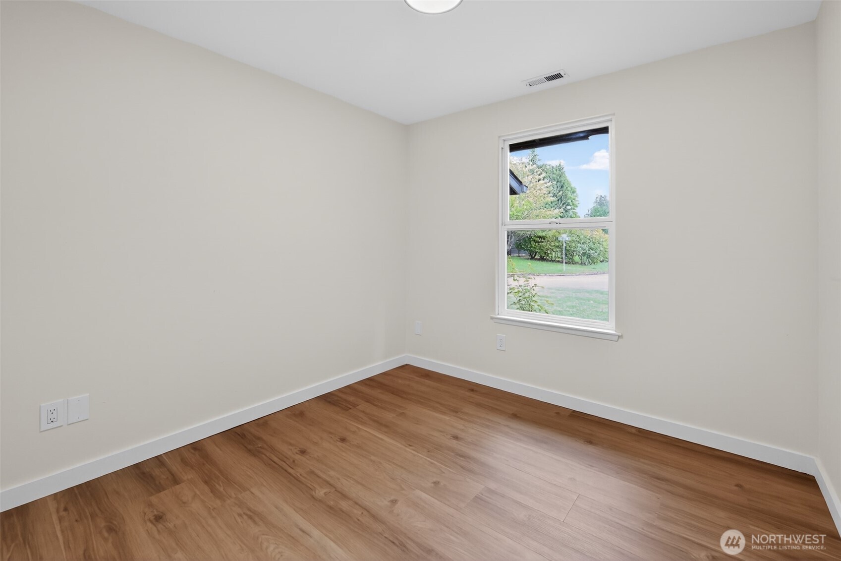 320 213th Place Southwest Bothell, WA 98021 - Photo 13 of 29 an empty room with wooden floor and a window