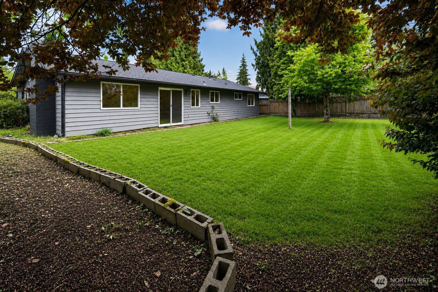 320 213th Place Southwest Bothell, WA 98021 - Photo 29 of 29 a view of a house with a backyard