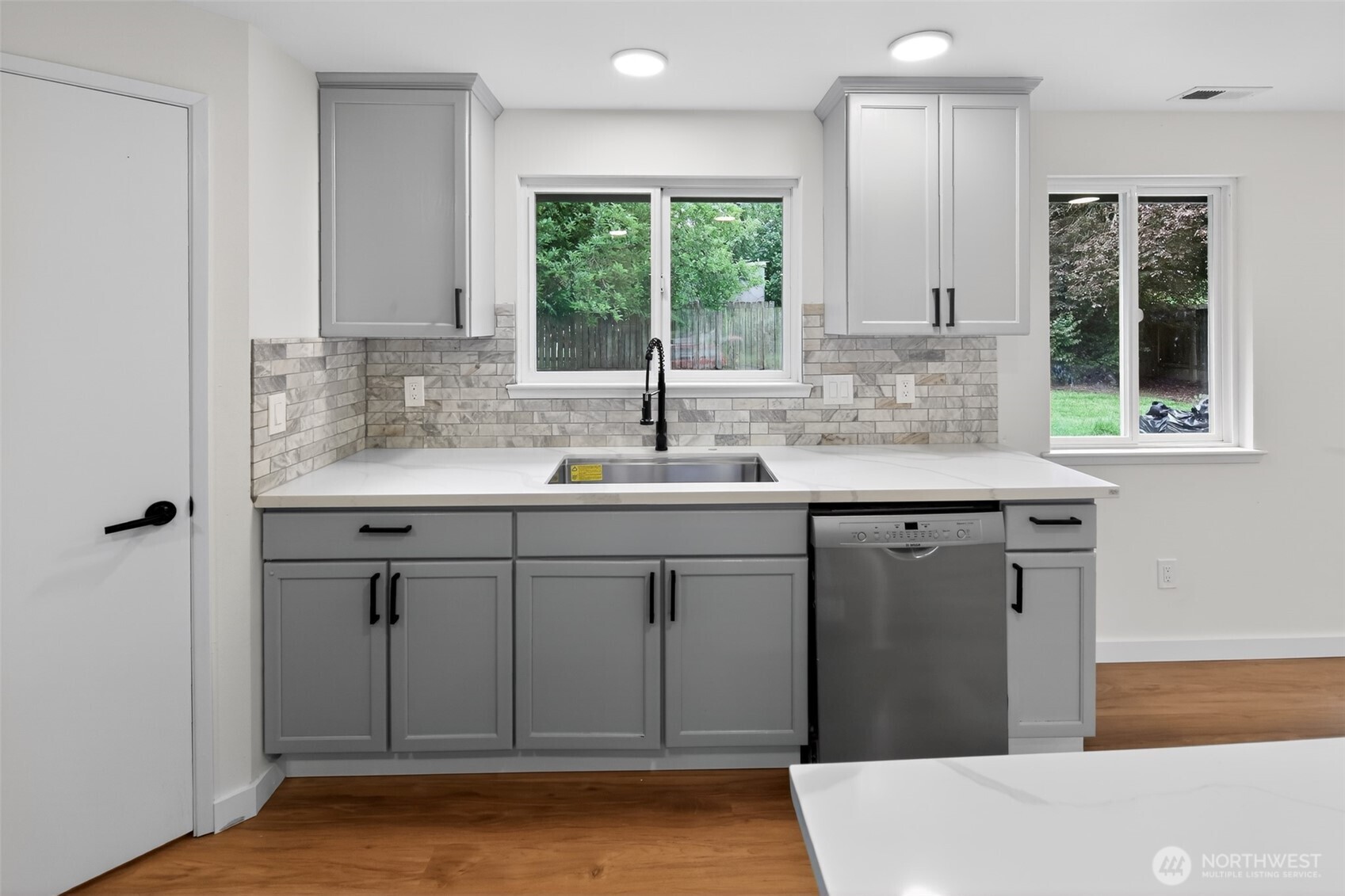 320 213th Place Southwest Bothell, WA 98021 - Photo 5 of 29 a kitchen with a sink cabinets and window