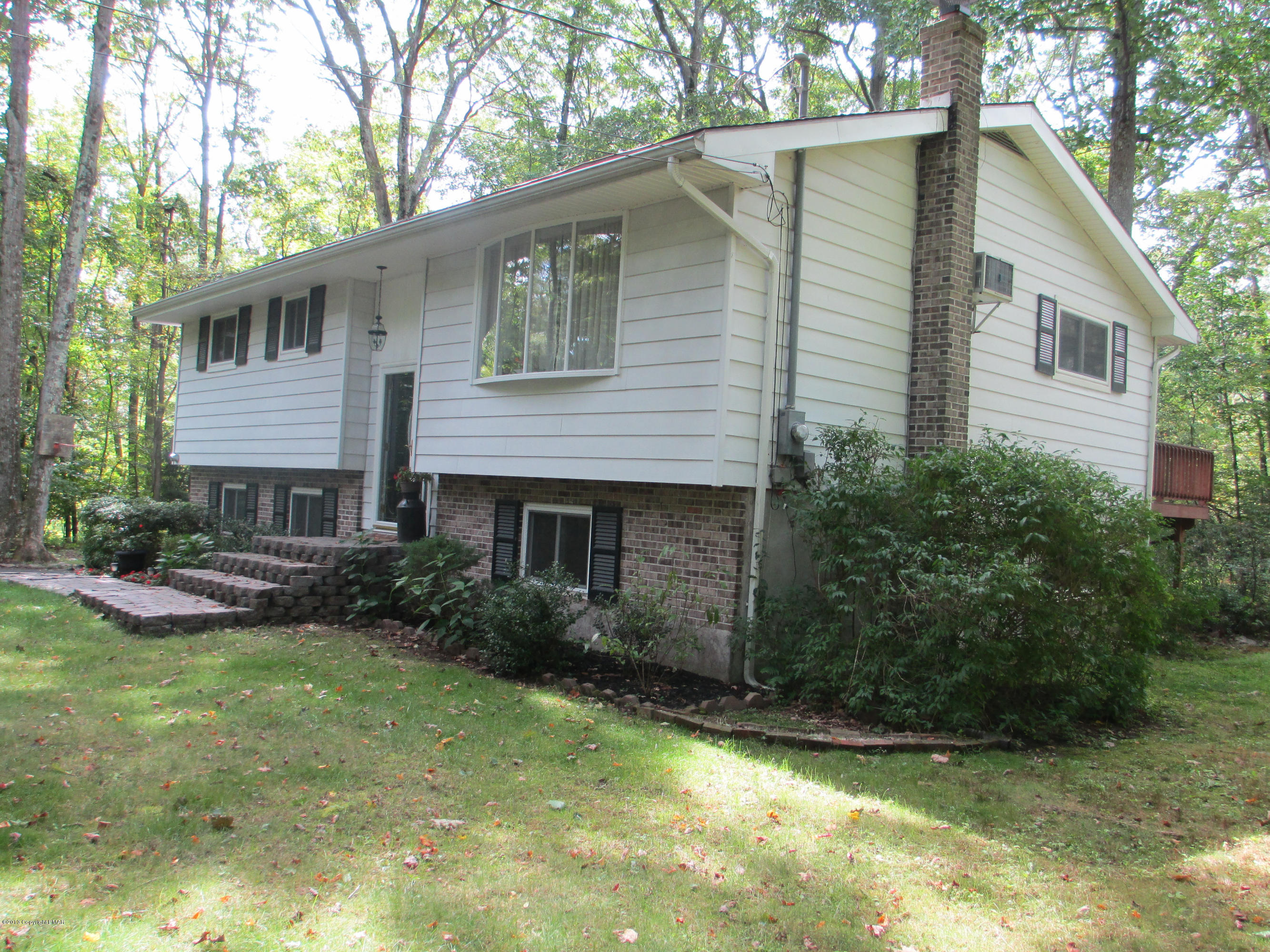 137 Williams Road Cresco, PA 18326 - Photo 2 of 33 a view of a house with a yard and sitting area