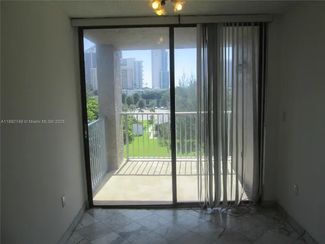 a view of entryway with floor to ceiling window