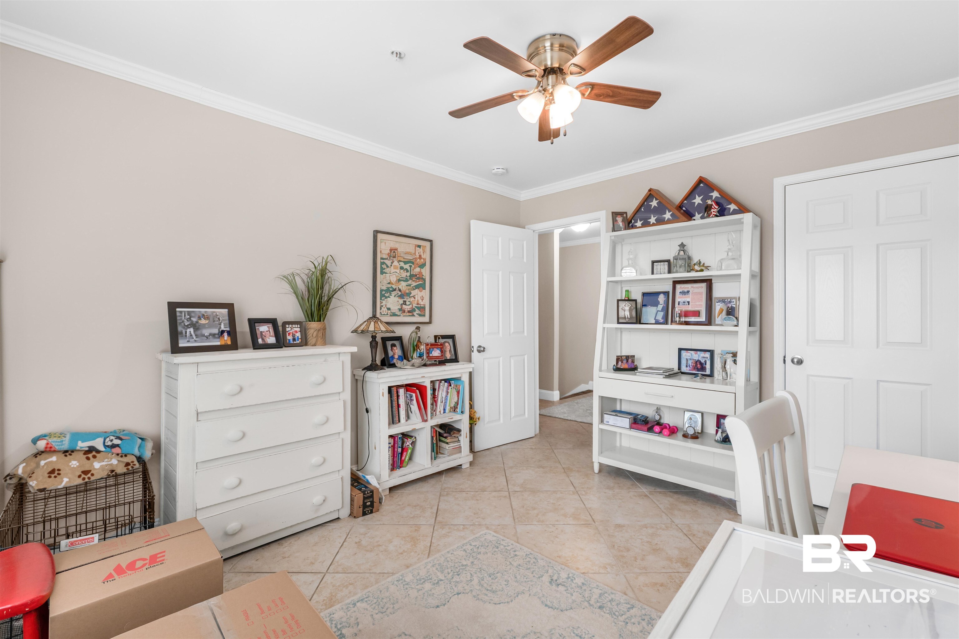 1517 Regency Road, Unit 68 Gulf Shores, AL 36542 - Photo 25 of 43 Interior space featuring ceiling fan, crown molding, and light tile patterned flooring
