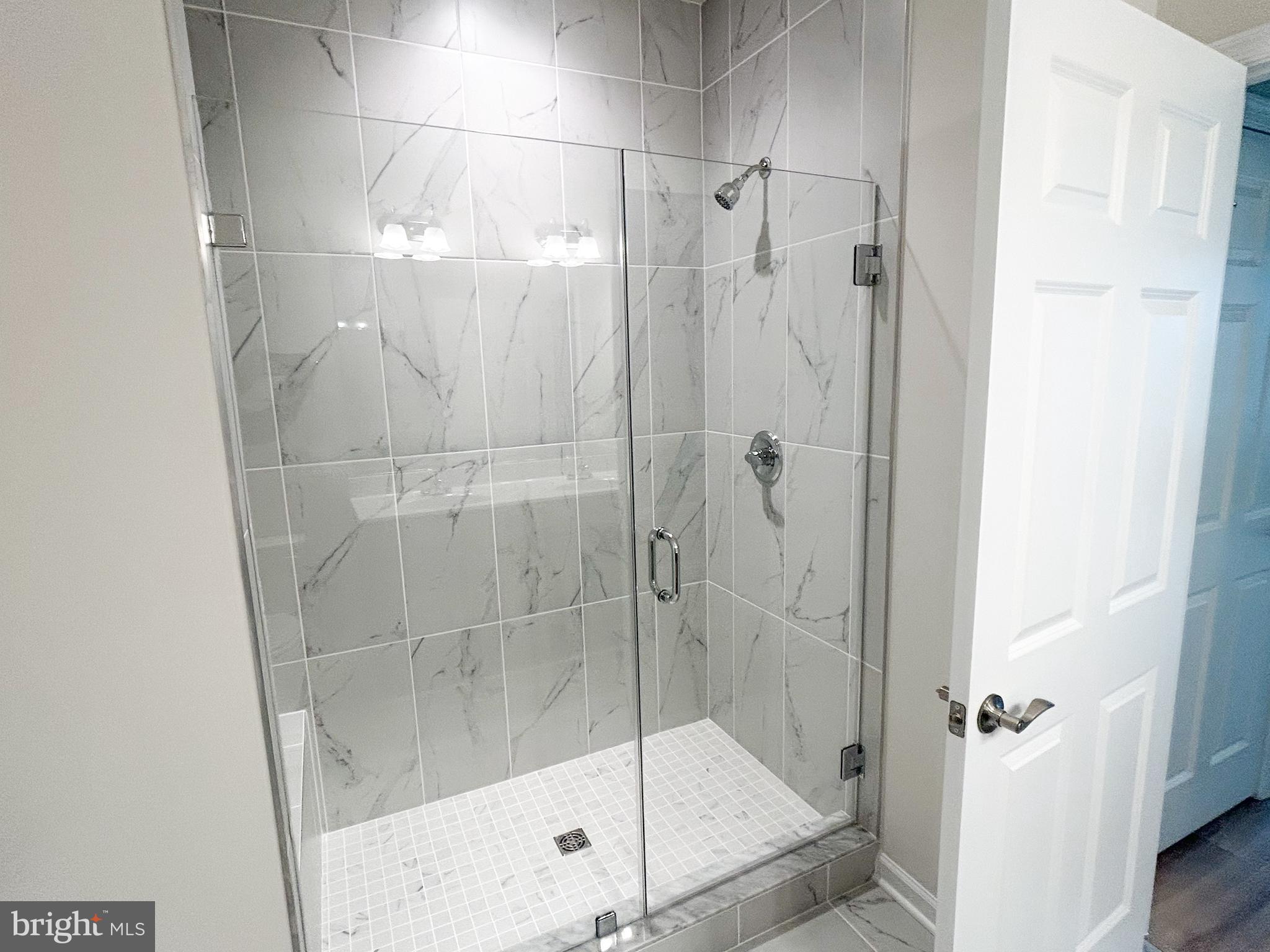 119 Heirloom Way Winchester, VA 22603 - Photo 14 of 26 a bathroom with a shower