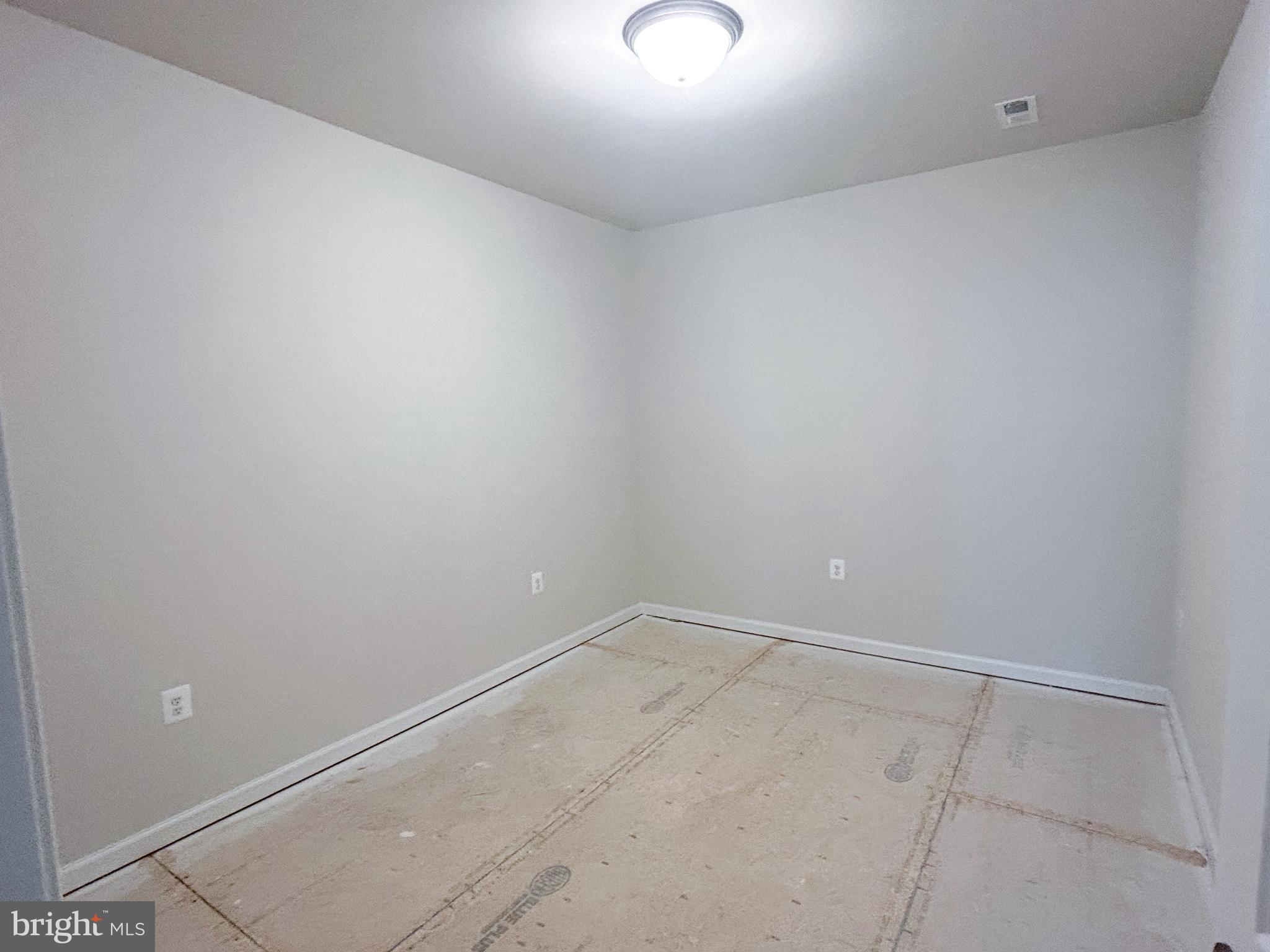 119 Heirloom Way Winchester, VA 22603 - Photo 19 of 26 an empty room with a workbench