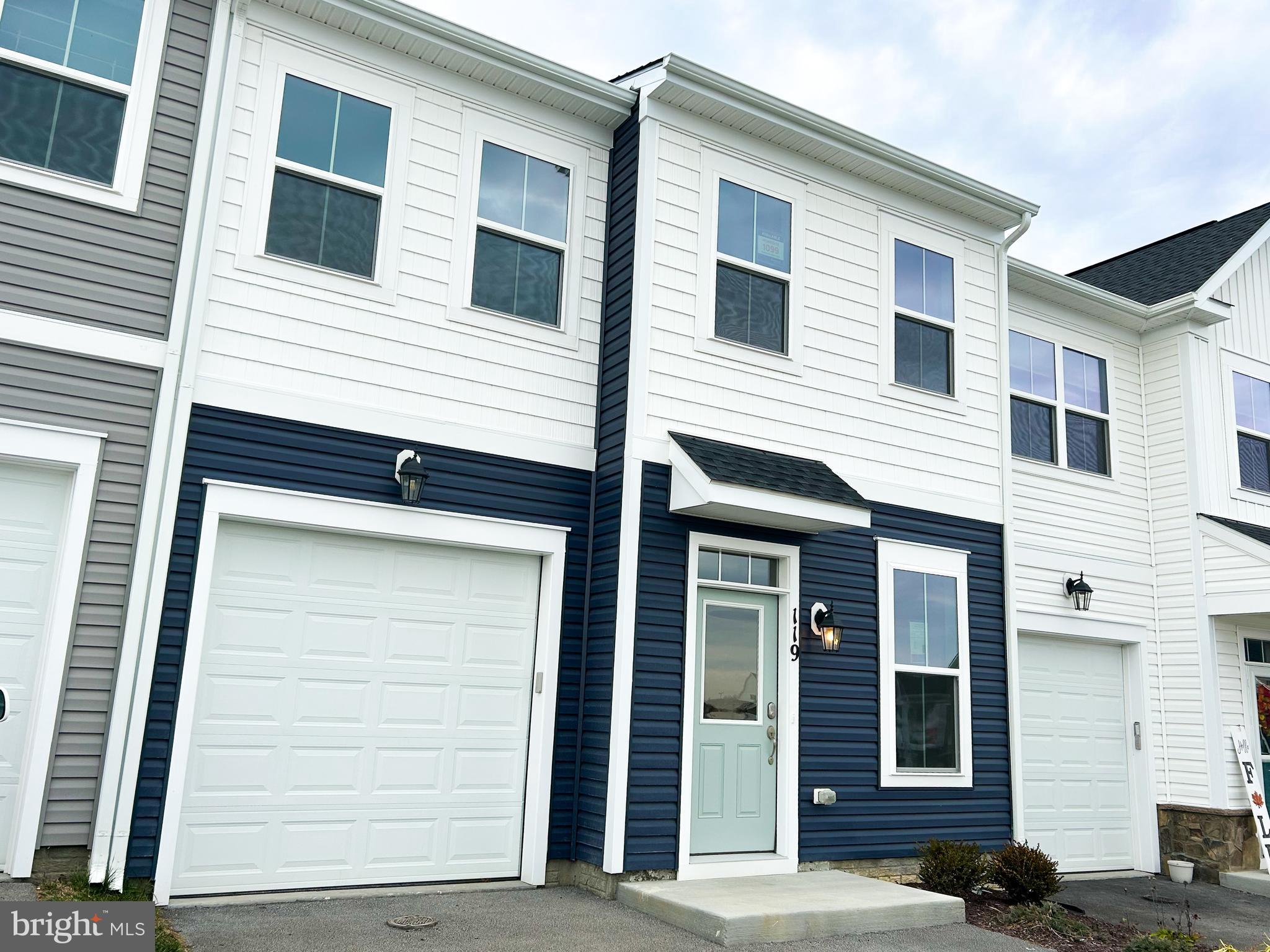 119 Heirloom Way Winchester, VA 22603 - Photo 2 of 26 a view of a house with more windows and brick walls