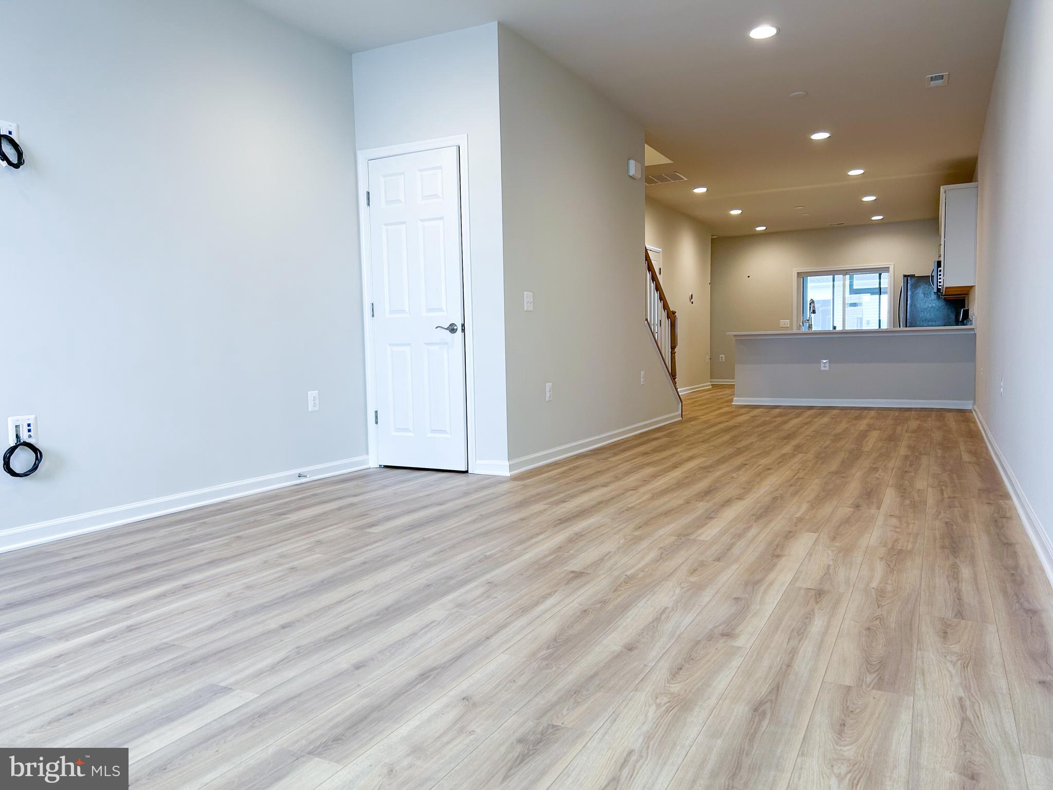 119 Heirloom Way Winchester, VA 22603 - Photo 4 of 26 a view of empty room with wooden floor and fan