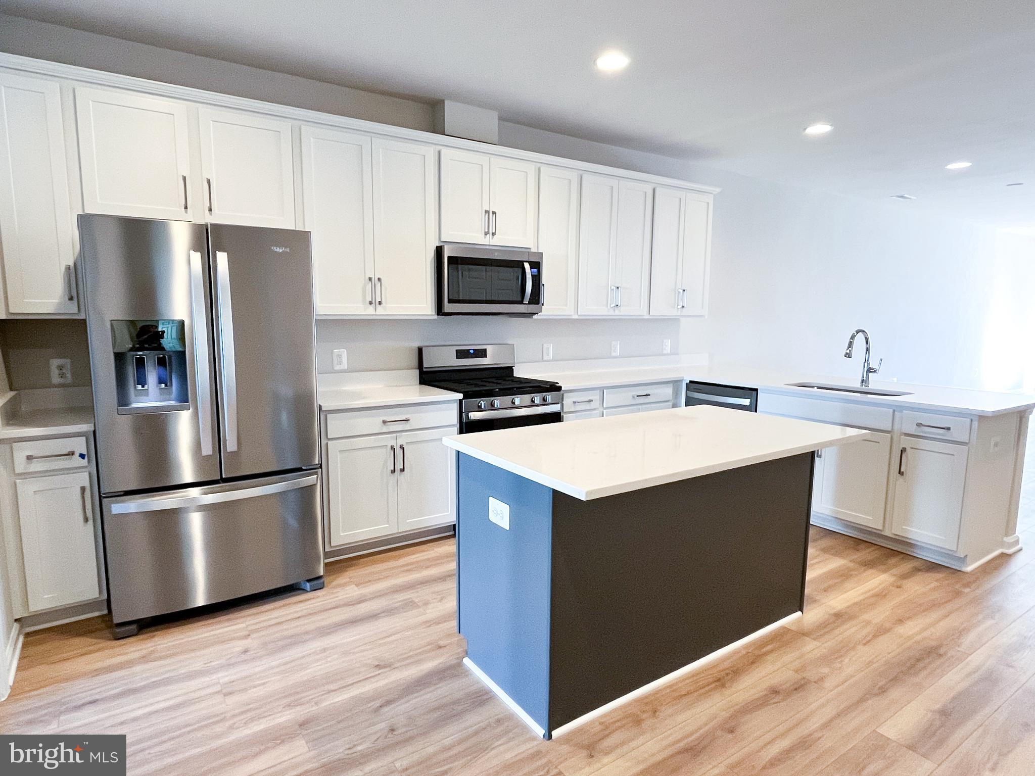 119 Heirloom Way Winchester, VA 22603 - Photo 7 of 26 a kitchen with wooden cabinets and stainless steel appliances