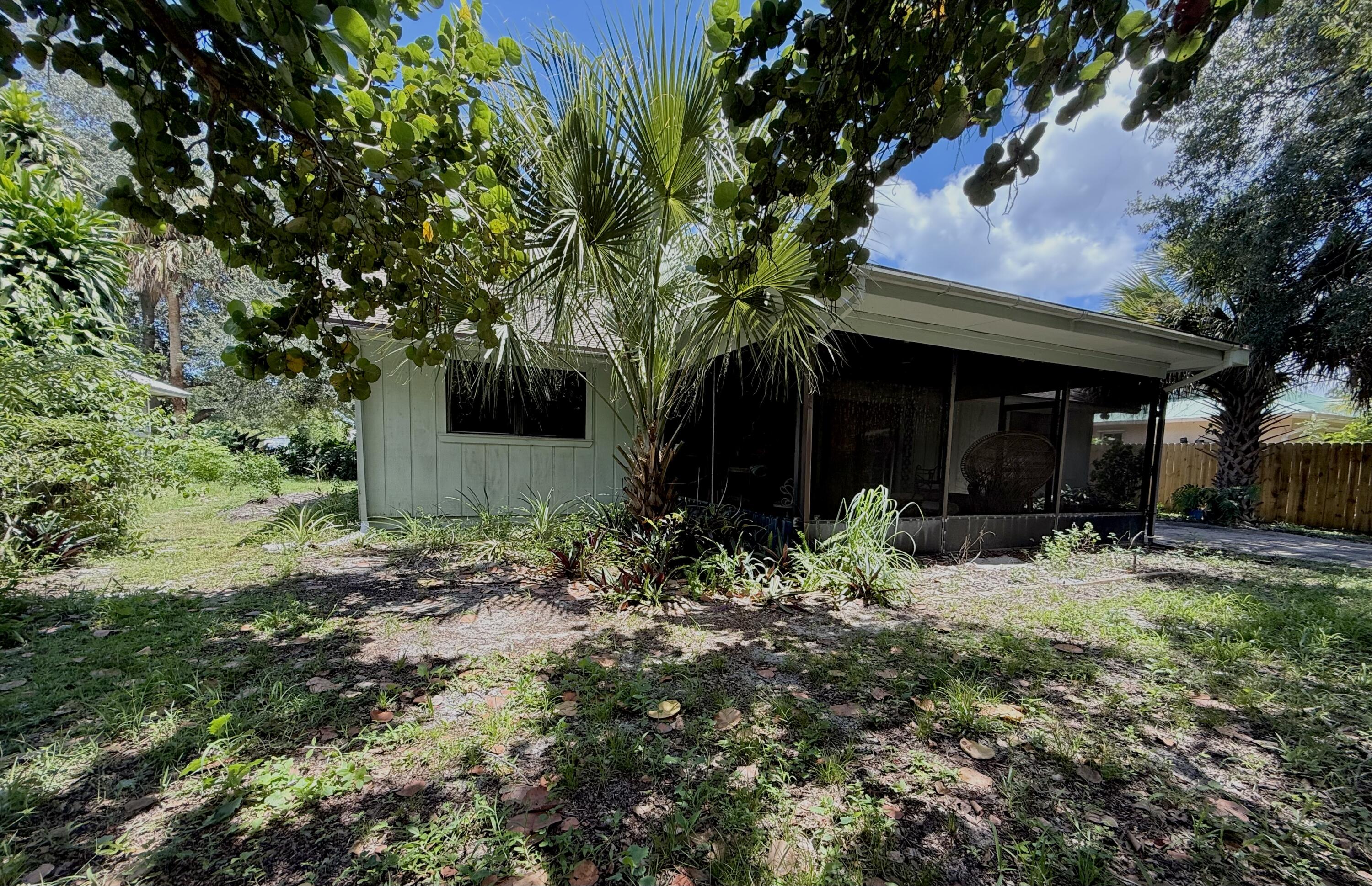 945 33rd Avenue Southwest Vero Beach, FL 32968 - Photo 19 of 22 a view of a house with yard and tree s