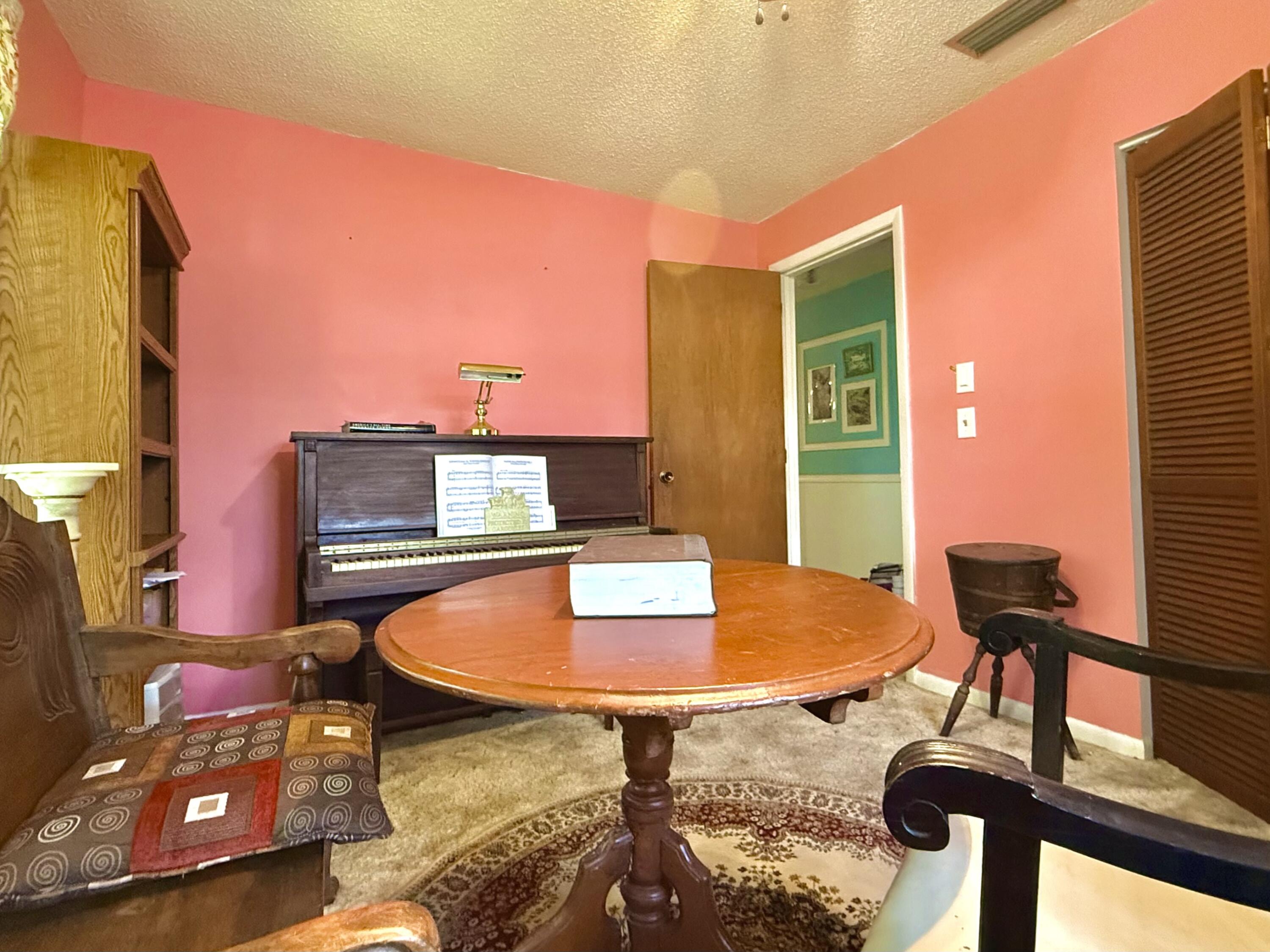 945 33rd Avenue Southwest Vero Beach, FL 32968 - Photo 3 of 22 a swimming pool with chairs