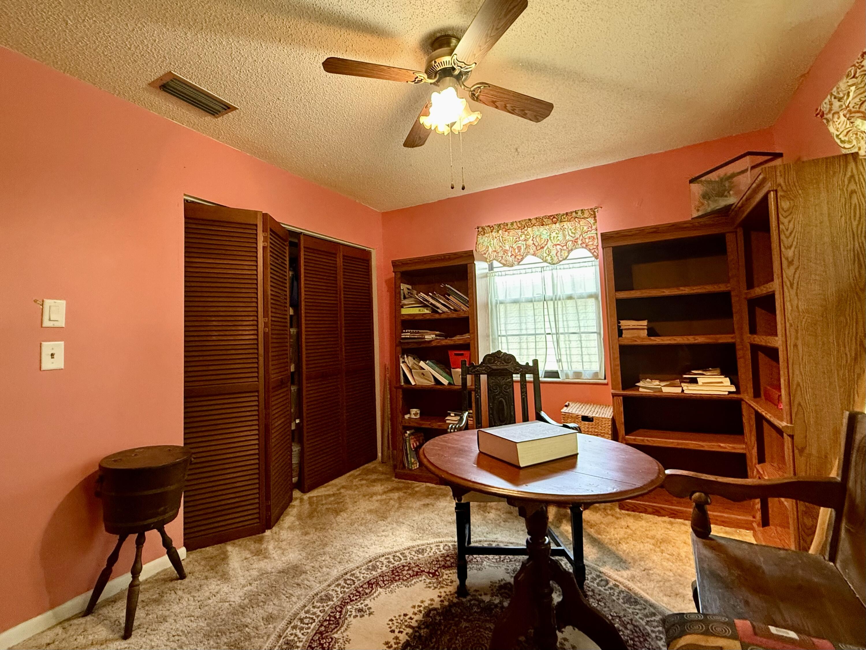 945 33rd Avenue Southwest Vero Beach, FL 32968 - Photo 5 of 22 a workspace with furniture window and outside view