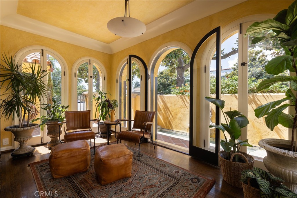 100 Temple Avenue Long Beach, CA 90803 - Photo 19 of 57 a living room with furniture and a floor to ceiling window