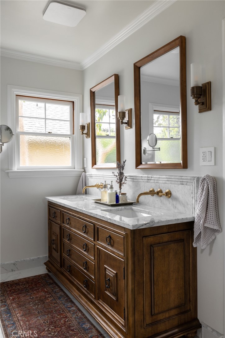 100 Temple Avenue Long Beach, CA 90803 - Photo 27 of 57 a bathroom with a granite countertop sink and a mirror