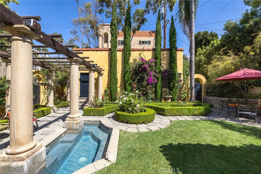100 Temple Avenue Long Beach, CA 90803 - Photo 36 of 57 a view of a house with a yard and sitting area