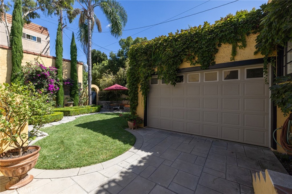 100 Temple Avenue Long Beach, CA 90803 - Photo 45 of 57 a view of a house with a small yard and a garden