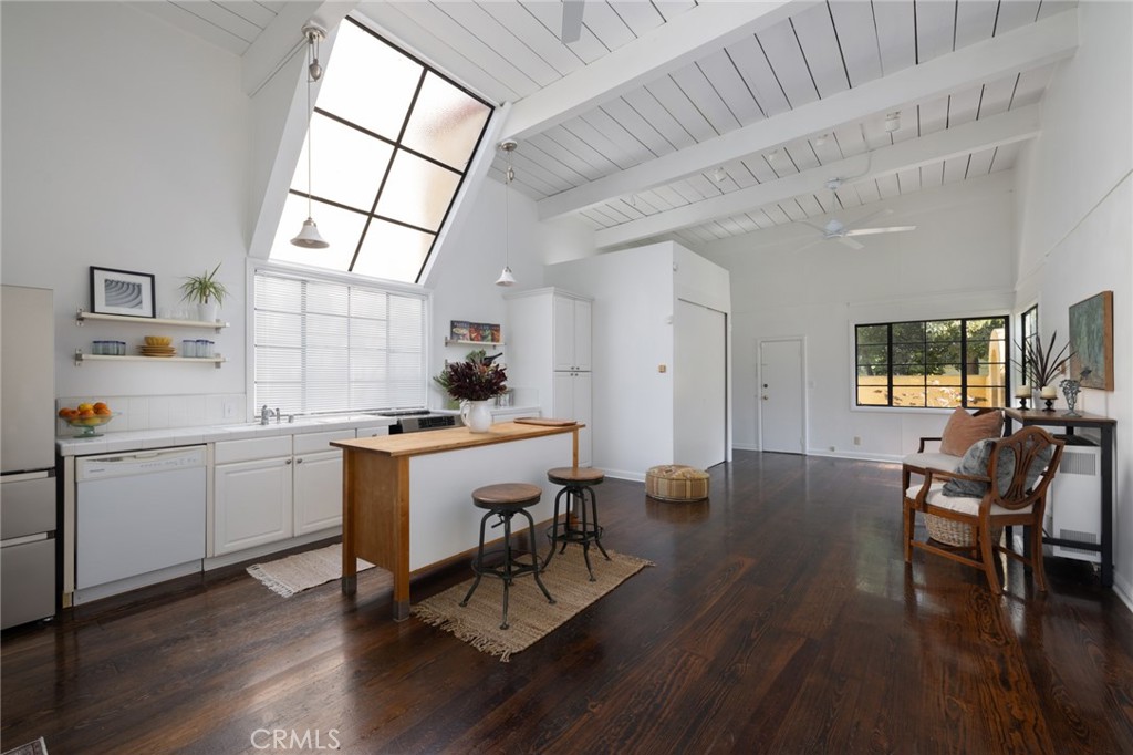 100 Temple Avenue Long Beach, CA 90803 - Photo 50 of 57 a room with dining table chairs wooden floor and a window
