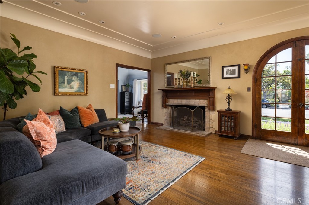 100 Temple Avenue Long Beach, CA 90803 - Photo 6 of 57 a living room with furniture large window and fireplace