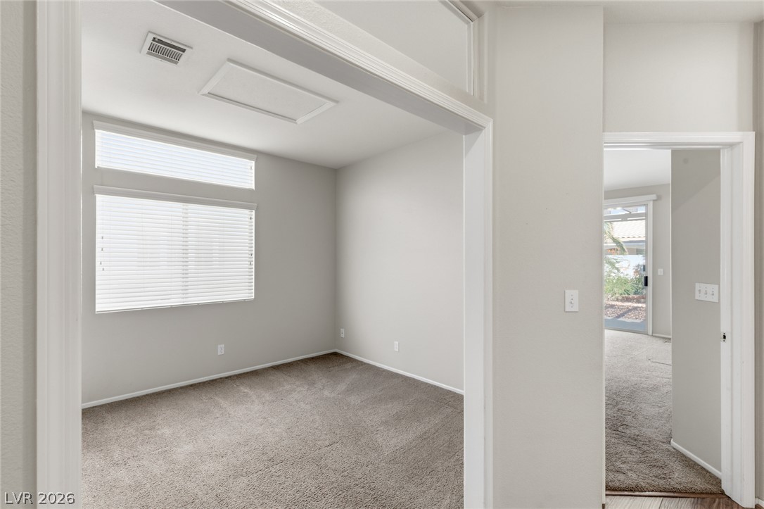 9034 Ridgepointe Way Henderson, NV 89074 - Photo 11 of 56 Plush carpeting and large windows create a comfortable, sunlit environment in this flexible bonus room.