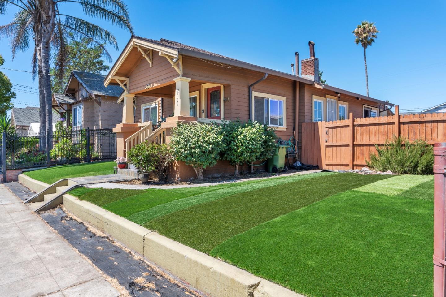 2009 69th Avenue Oakland, CA 94621 - Photo 1 of 16 a front view of house with yard and green space