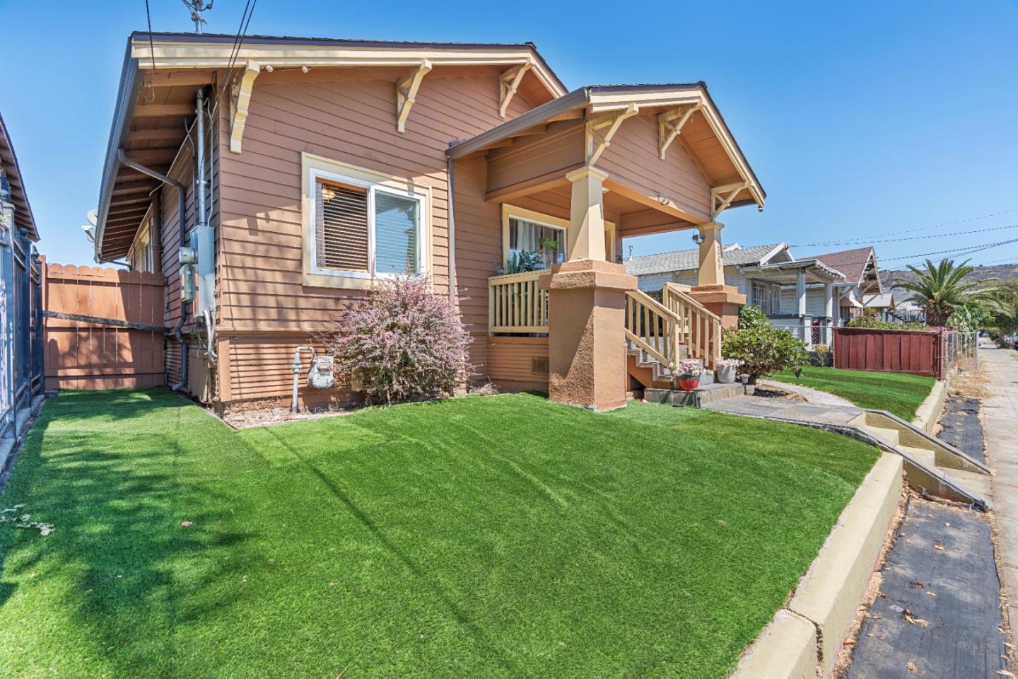 2009 69th Avenue Oakland, CA 94621 - Photo 3 of 16 a front view of a house with a yard