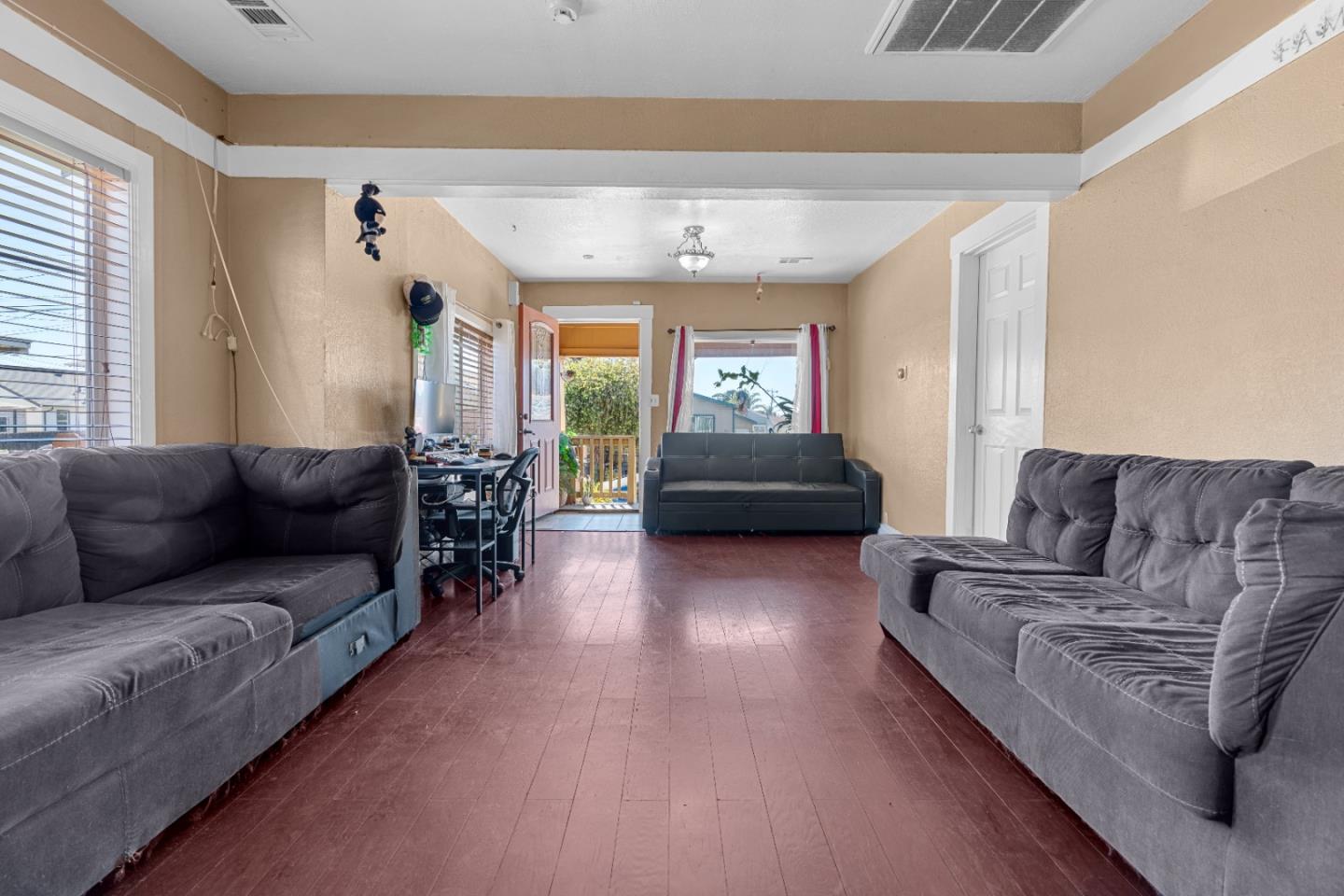 2009 69th Avenue Oakland, CA 94621 - Photo 6 of 16 a living room with furniture and a large window