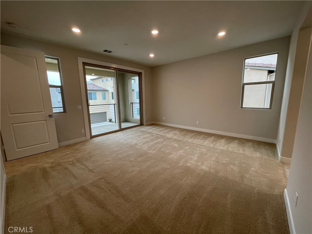145 Denali Lake Forest, CA 92630 - Photo 5 of 17 a view of an empty room with a window