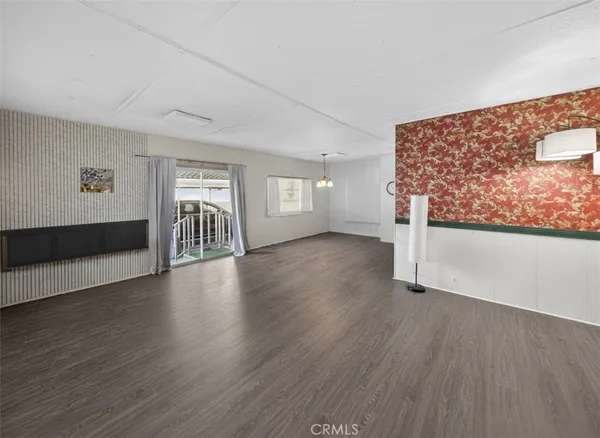 a view of a livingroom with wooden floor