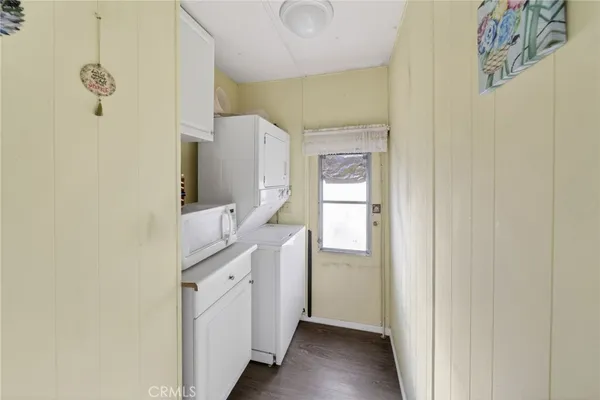 a kitchen with a refrigerator and a sink