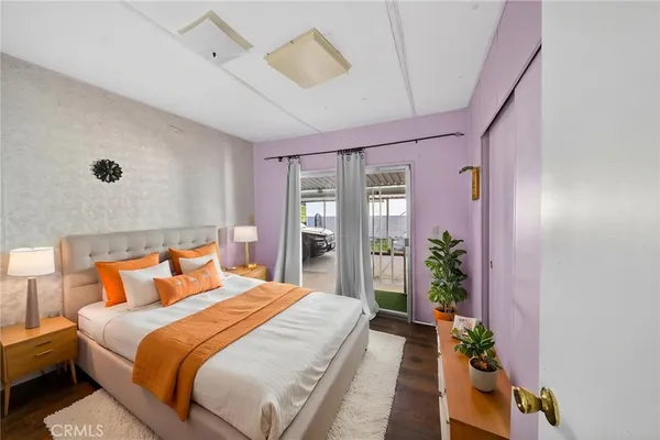 a bedroom with bed and flowers