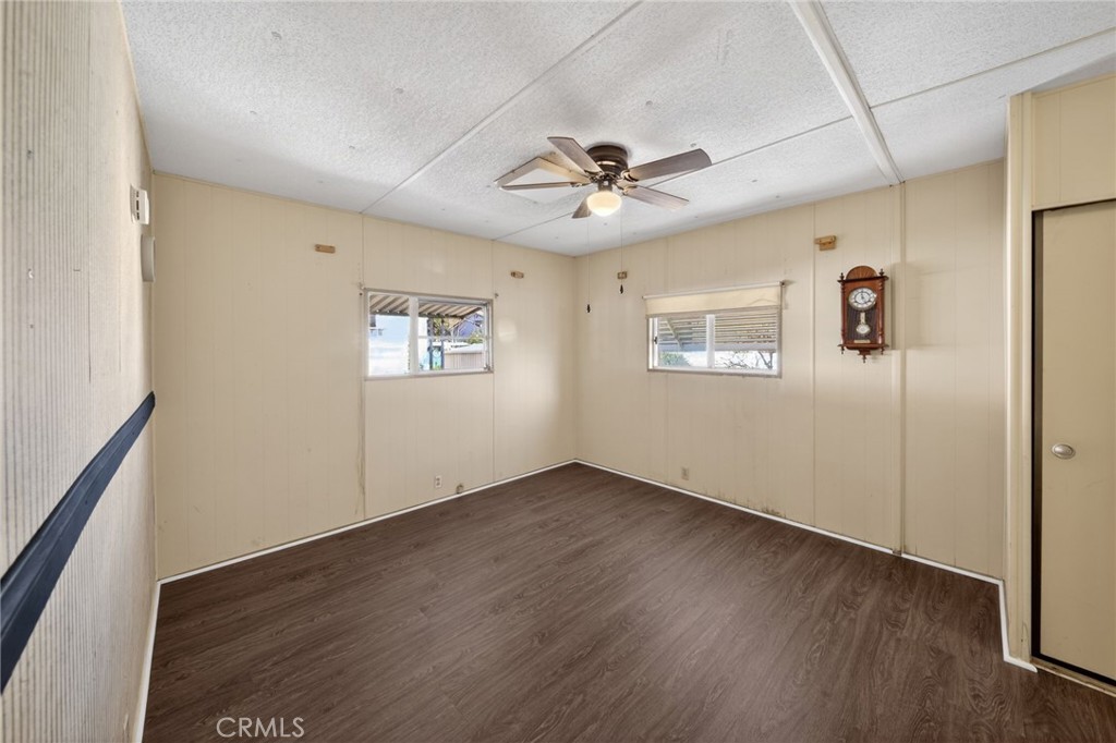 12656 2nd Street, Unit 55 Yucaipa, CA 92399 - Photo 20 of 29 a view of an empty room with a window and wooden floor