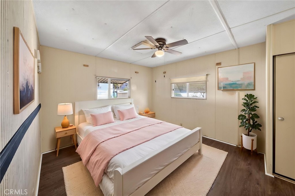 12656 2nd Street, Unit 55 Yucaipa, CA 92399 - Photo 21 of 29 a bedroom with a large bed and a chandelier