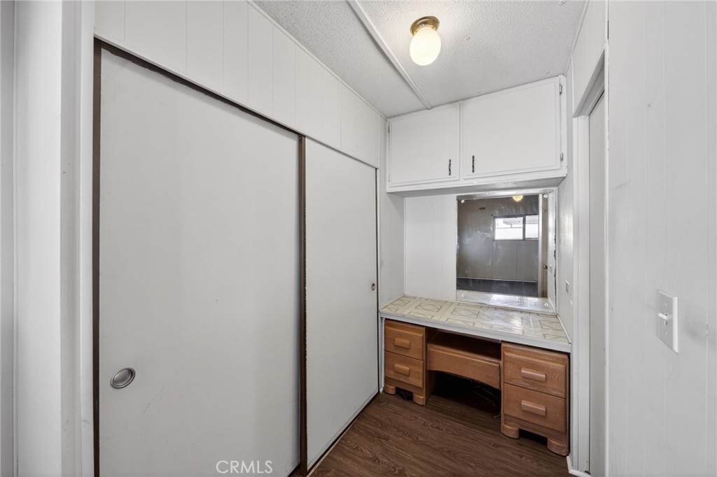 12656 2nd Street, Unit 55 Yucaipa, CA 92399 - Photo 25 of 29 a bathroom with a sink a mirror and a toilet