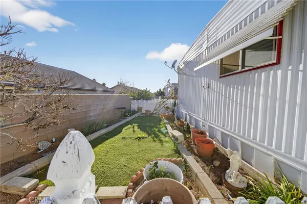 a view of a swimming pool with a yard