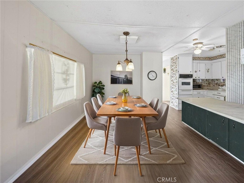 12656 2nd Street, Unit 55 Yucaipa, CA 92399 - Photo 10 of 29 a view of a dining room with furniture window and wooden floor