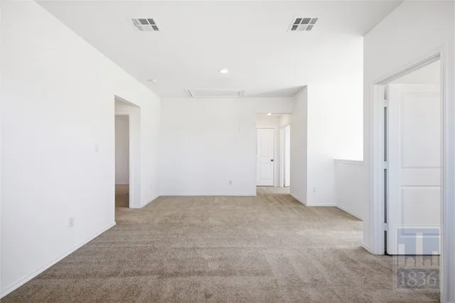 an empty room with a bathroom