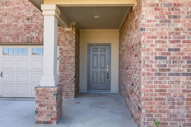 a view of entryway with brick walls